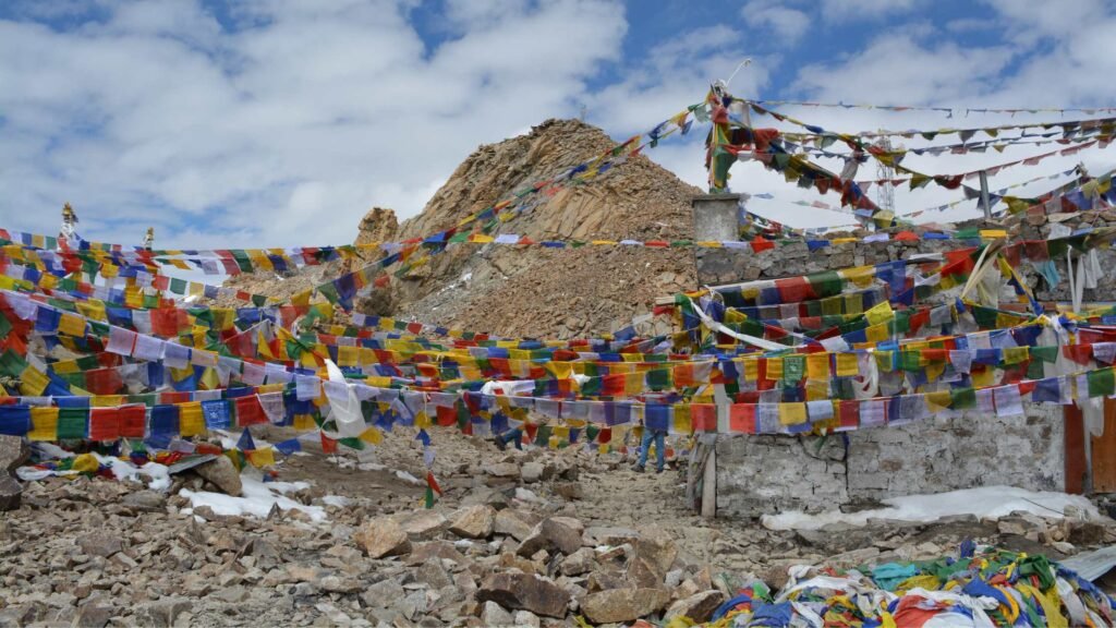 Khardung La Pass Leh Ladakh during summer with clear skies and scenic Himalayan mountain road