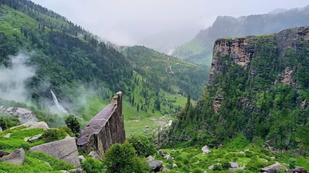 Rahala Falls Manali cascading through lush green forests and rocky Himalayan cliffs