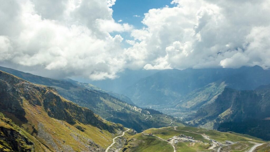 Rohtang Pass Manali in summer with clear skies, winding mountain roads, and scenic Himalayan landscape