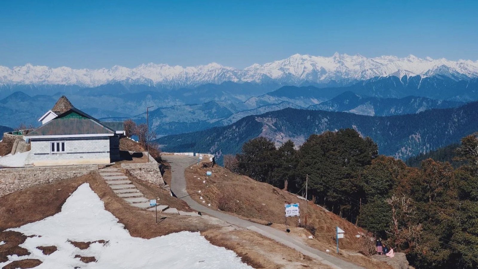 Panoramic snow covered mountain view surrounding Hatu Peak in Narkanda near Shimla in Winters