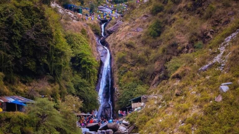 Scenic Bhagsunag Waterfall surrounded by Himalayan mountains in Dharamshala