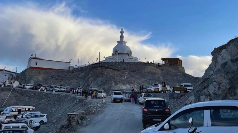 Travellers exploring Shanti Stupa during a Leh Ladakh trip